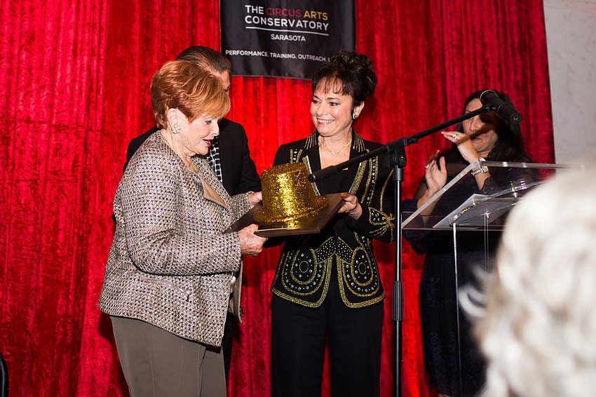 Mary Ann Robinson receives her award from Dolly Jacobs.