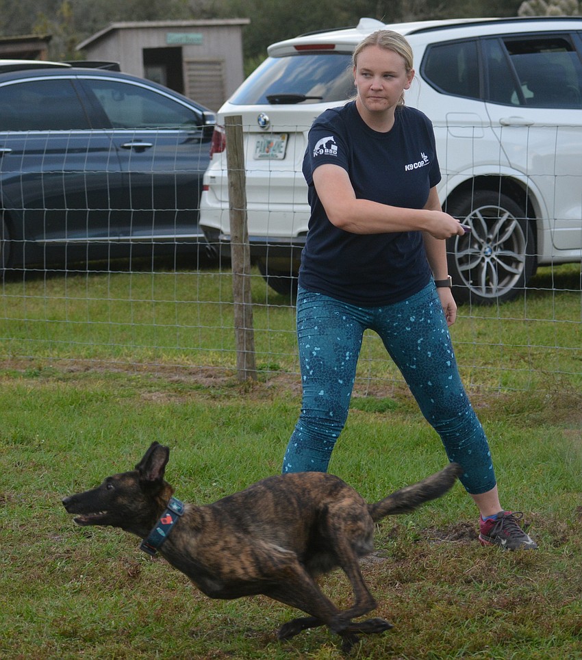 Allie Menendez and her dog Sire, a 2-year-old Dutch Shepherd.