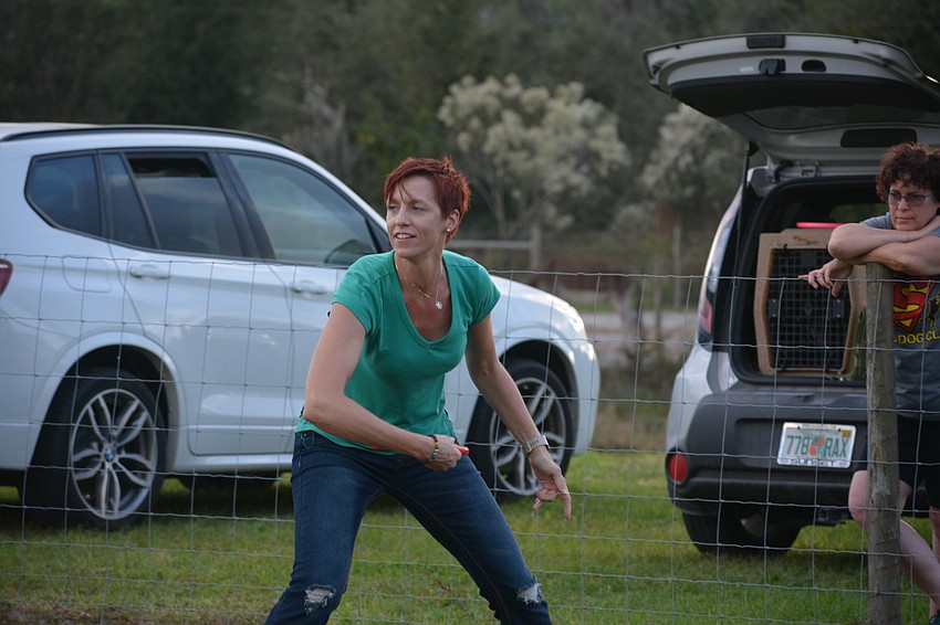 Parrish's Paulina Sanborn tosses to her dog Heist, a border collie mix.