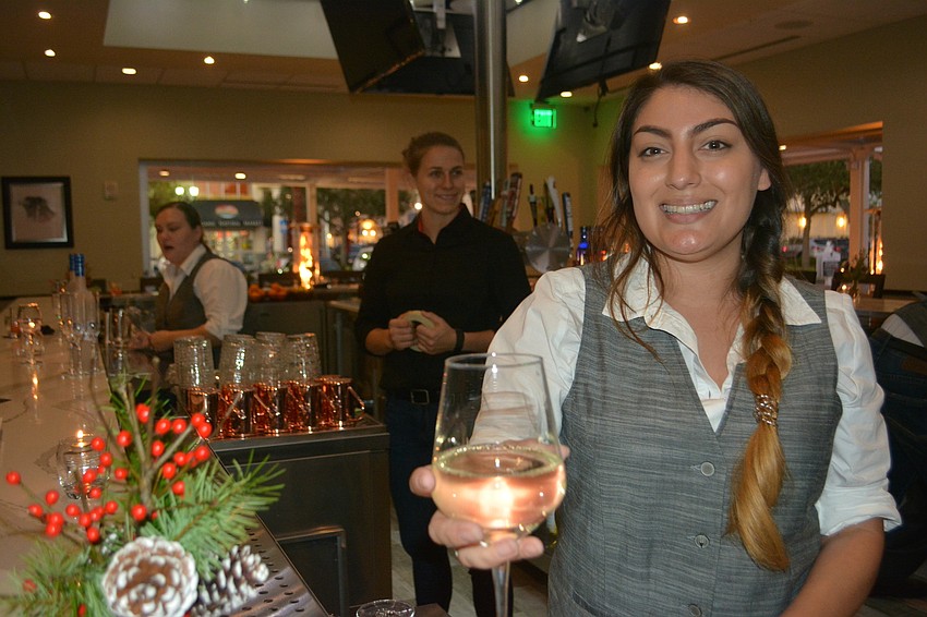 Bartender Jasmine  Haas will be delivering drinks at the bar.