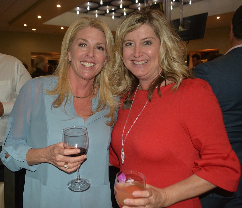 Lisa Kirkland, the director of marketing at Lakewood Ranch Medical Center, visits with Heather Kasten, the CEO of the Lakewood Ranch Business Alliance.