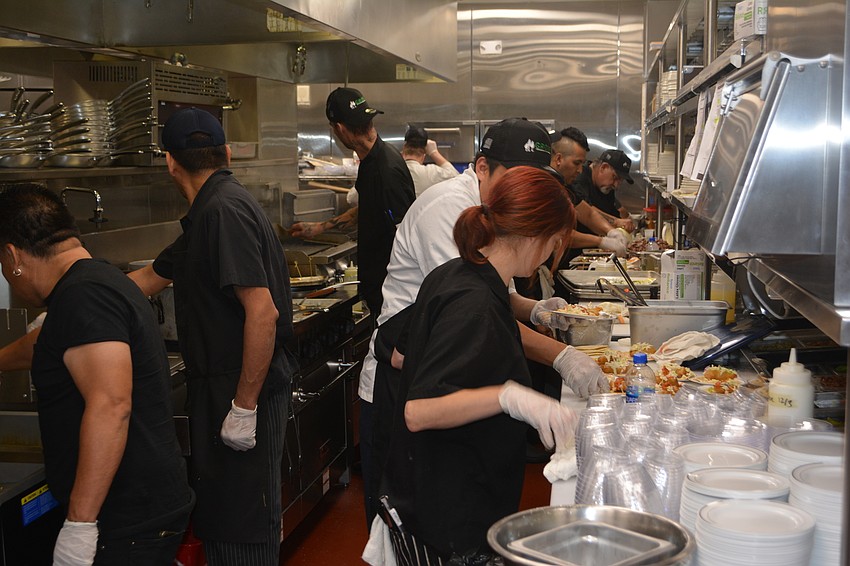 An assembly line of chefs was going full bore during the sneak preview.