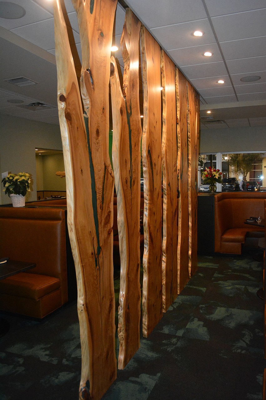 The new interior includes wood from a white cedar that was brought down at Holmes Beach due to Hurricane Irma. It forms the 