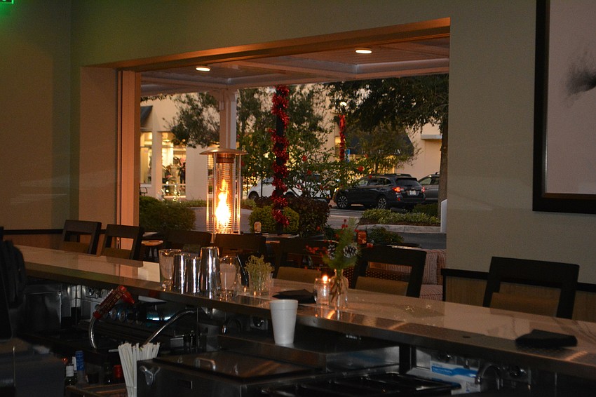 The restaurant and bar opens up to Lakewood Main Street.