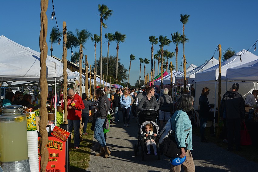 Ten minutes after The Market opened for the first time this year Wednesday, patrons packed an aisle between the booths.