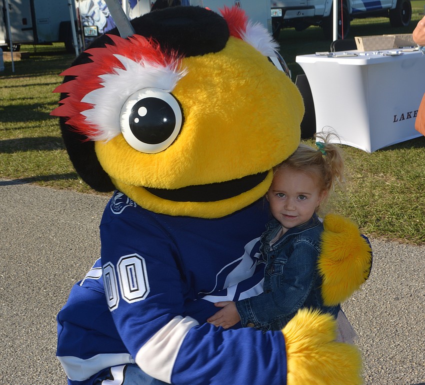 Lightning mascot Thunderbug gives a big hug to Lakewood Ranch 3-year-old Claire Pies at The Market.
