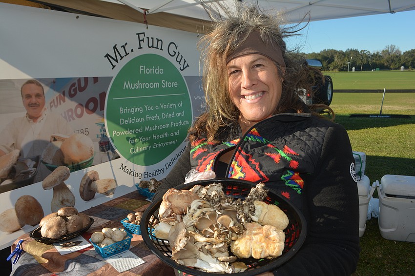 Beanca Gordner of Mr. Fun Guy shows off a selection of gourmet mushrooms.