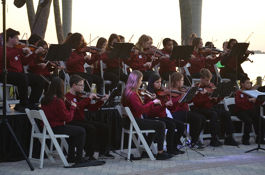 Heron Creek Middle School Orchestra plays a medley of holiday songs.