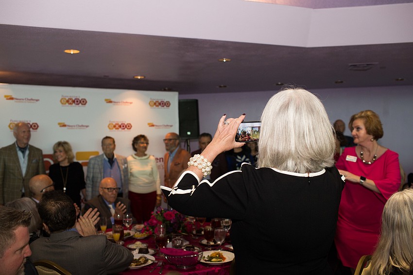 The models line up for a photo.