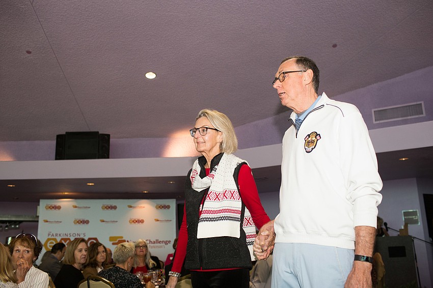 Nancy and Merv Faris walk the runway.