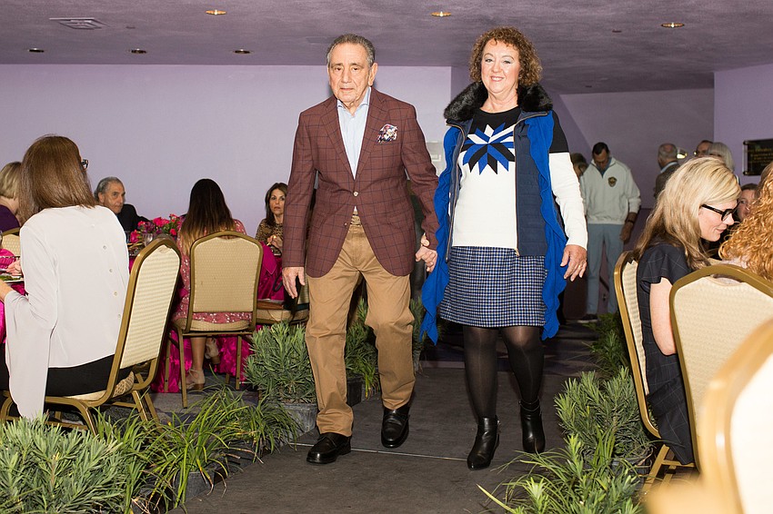 Al and Michelle Rossomangno walk the runway.