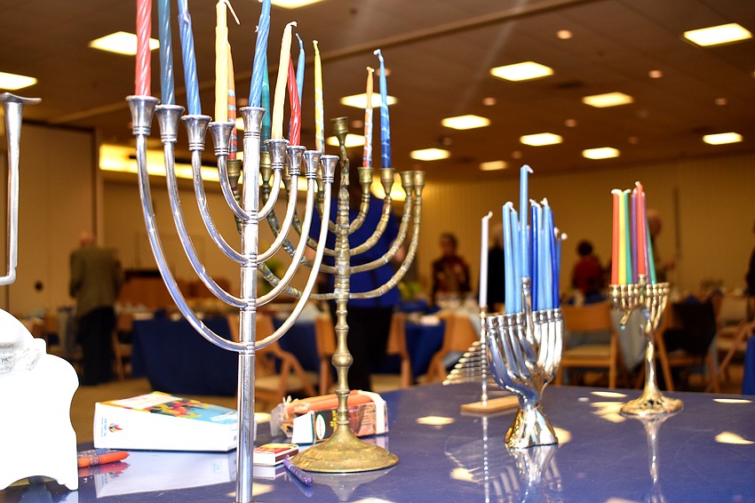 Temple members brought their personal menorahs and placed them together before the candle lighting.