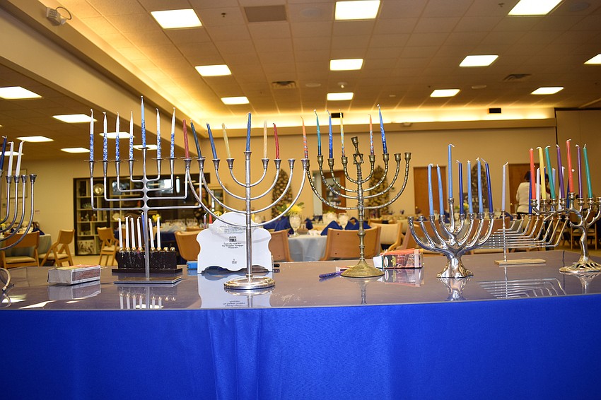 Temple members brought their personal menorahs and placed them together before the candle lighting.