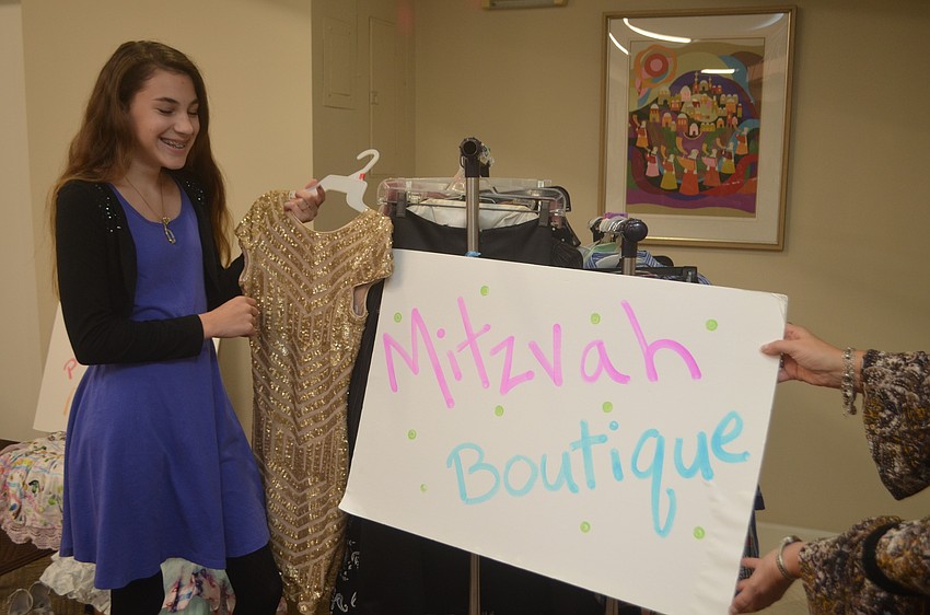 Abbie Mount manned the clothing rack at the fundraising event.