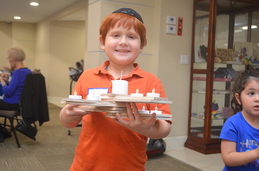 Woody Bryant is the only temple member to make a menorah for the Menorah contest.