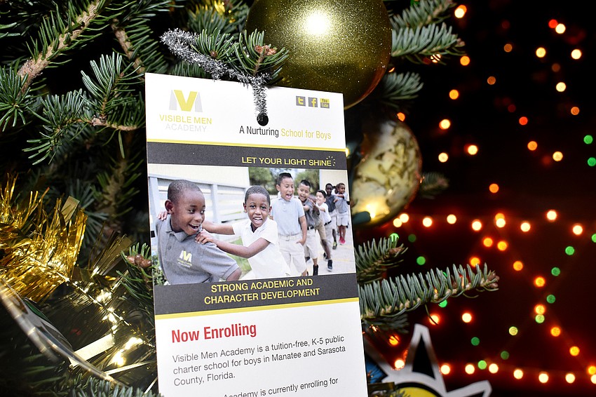 Seven local nonprofit organizations decorated Christmas trees that lined a walkway to Santa.