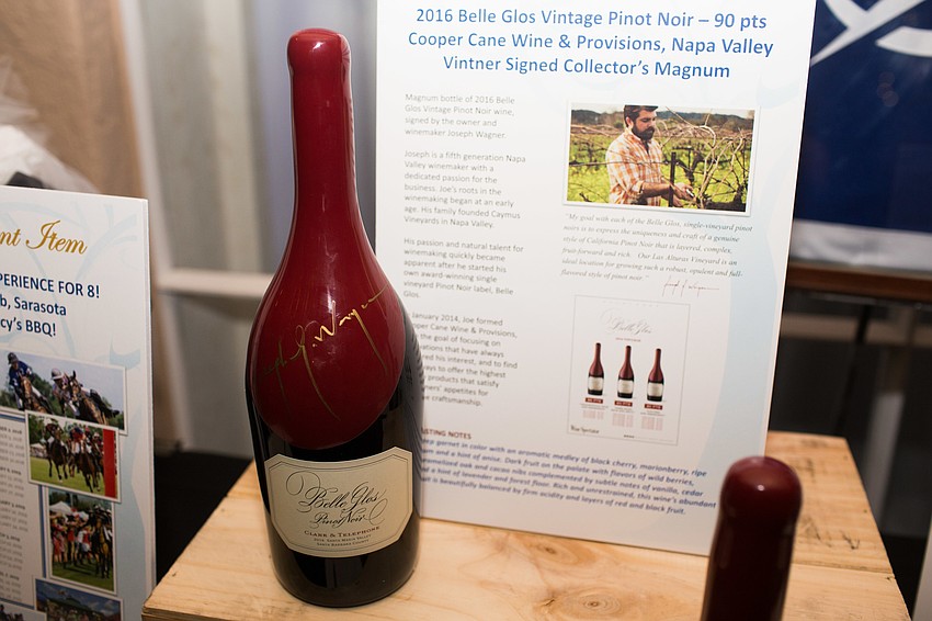The silent auction included many items, such as this signed bottle of wine.