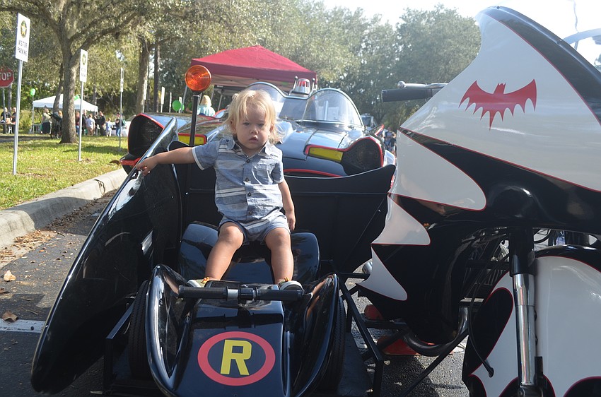 Noah Ricker takes a seat in the sidecar of the Batcycle.