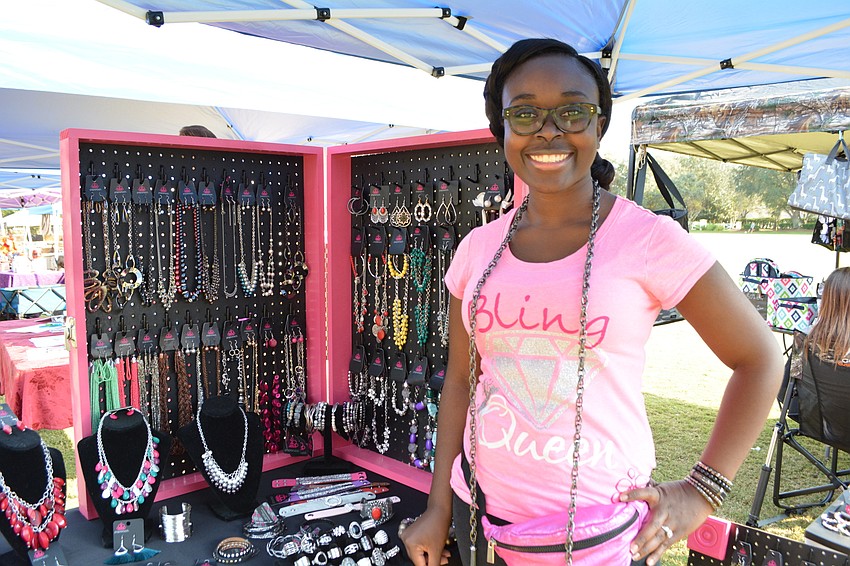 Paparazzi jewelry consultant Ebony Owen shows off her $5 jewelry selection.