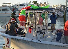 Boats were prepared for the parade in the marina by the Marina Jack restaurant.