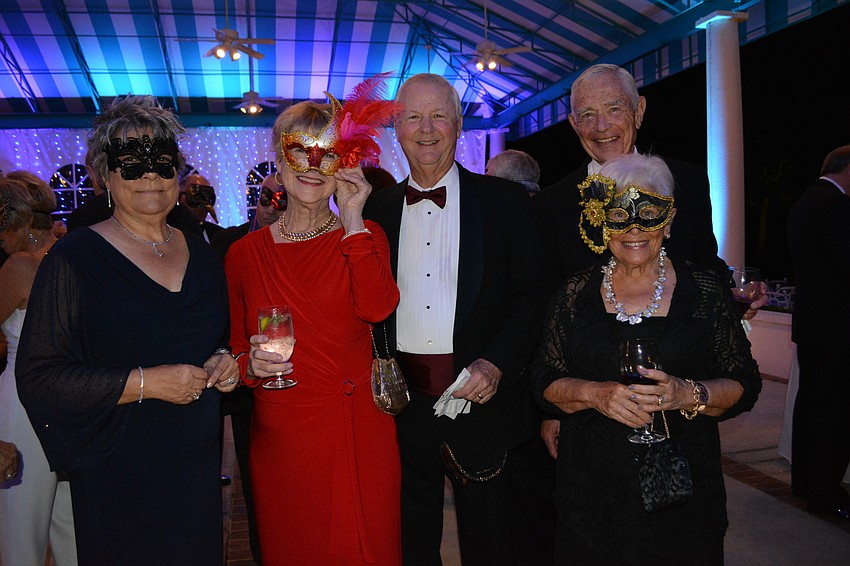 Barbara Somma with Karen and John Mathis meet up with first-time ball attendees Steven and  Marjorie Sayer.