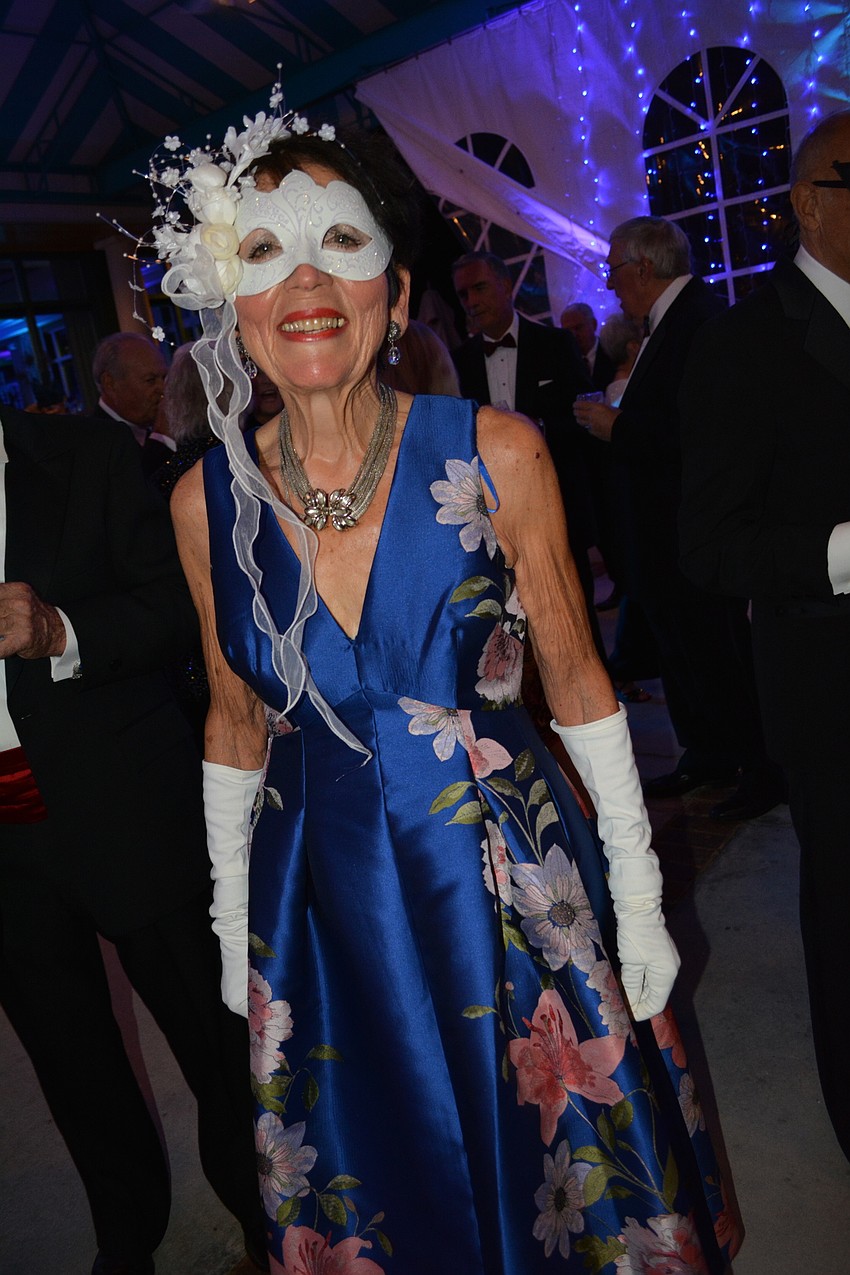 Carol Shabe found her mask on Amazon and her dress at Dillard's.