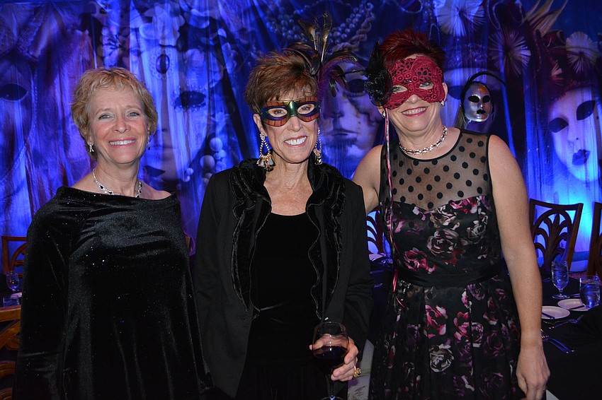 Ronni Loundy joins event committee members Deborah Van Brunt and Jeanie Blazey. Brunt and Blazey spent nine hours decorating the clubhouse.