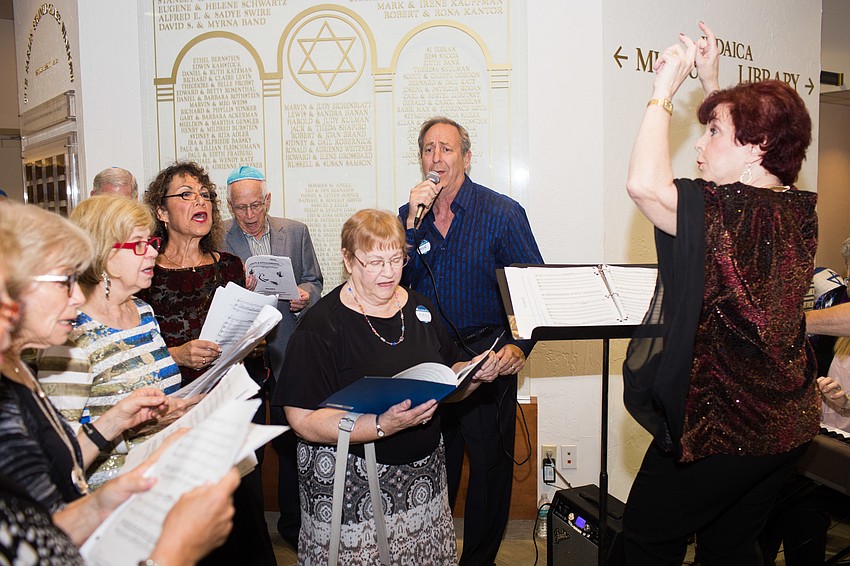 Guests sing during the social hour.