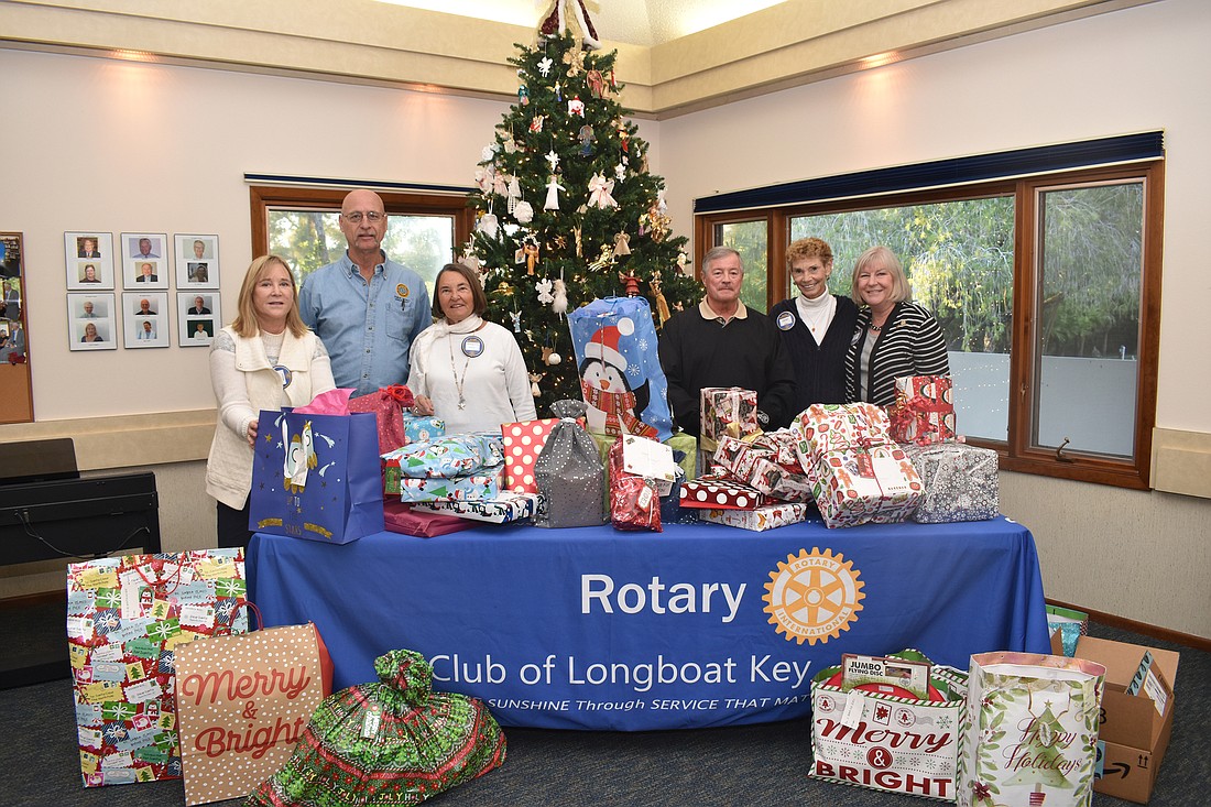 The Rotary Club of Longboat Key collected wrapped gifts for the Knights of Columbus.