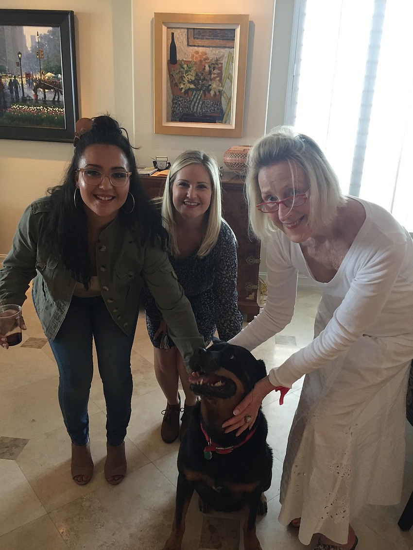 Palm Avenue neighbors celebrated the life of a dog whose cheery disposition endeared her to many. Dora, an 8-year-old Doberman, was ill and heading back up north for the summer – likely the last time her friends would see her.