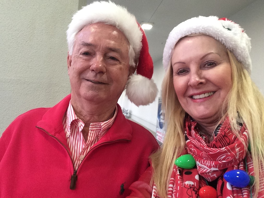 Town Commissioner Jim Brown and Susan Phillips at their bell-ringing station.