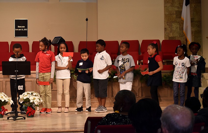 Second graders from 13th Avenue Dream Center take turns reading to Christ Church members.