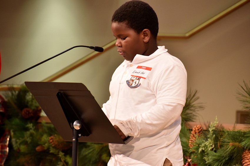 Everett Bell recites a Christmas-related story to Christ Church members.