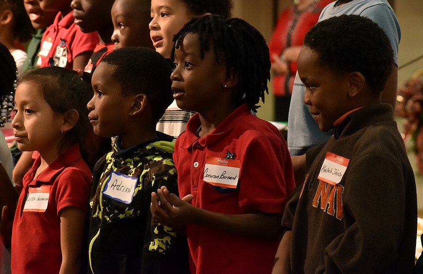 Students of  13th Avenue Dream Center sing “Away in a Manger.”