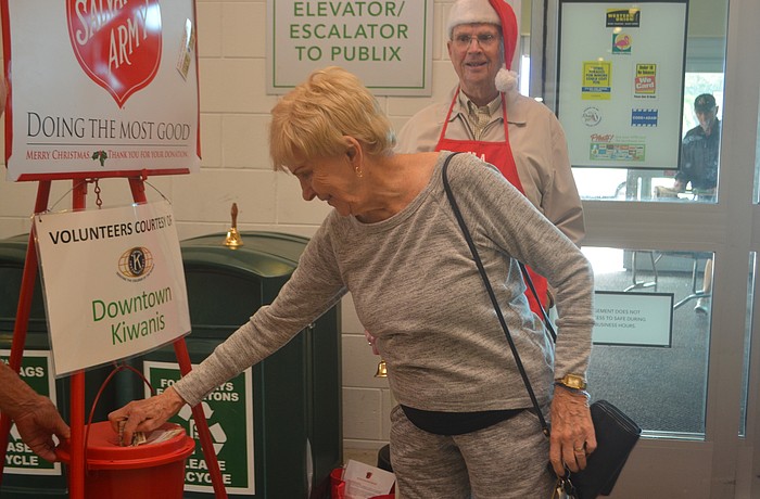 Peggy O'Donnell makes a donation at the Publix on Bay Street.