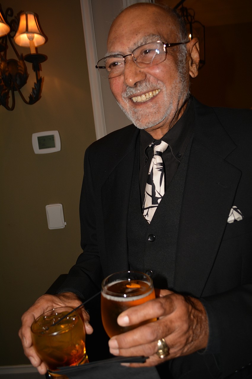 Aroon Chaddha heads to his table for dinner with his wife, Lilly, not pictured, and friends.