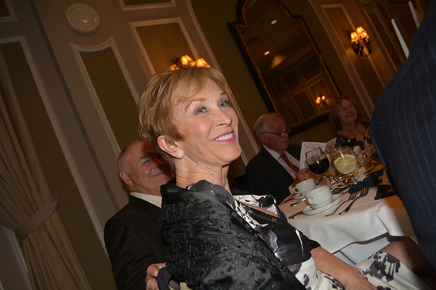 Country Club resident Martha Gaffney smiles as Club President Eileen Buzzard shares about the group's accomplishments in 2018.