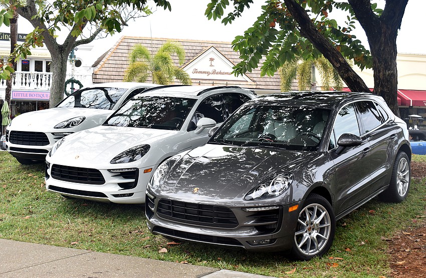 New and older models of Porsches lined St. Armands Circle.