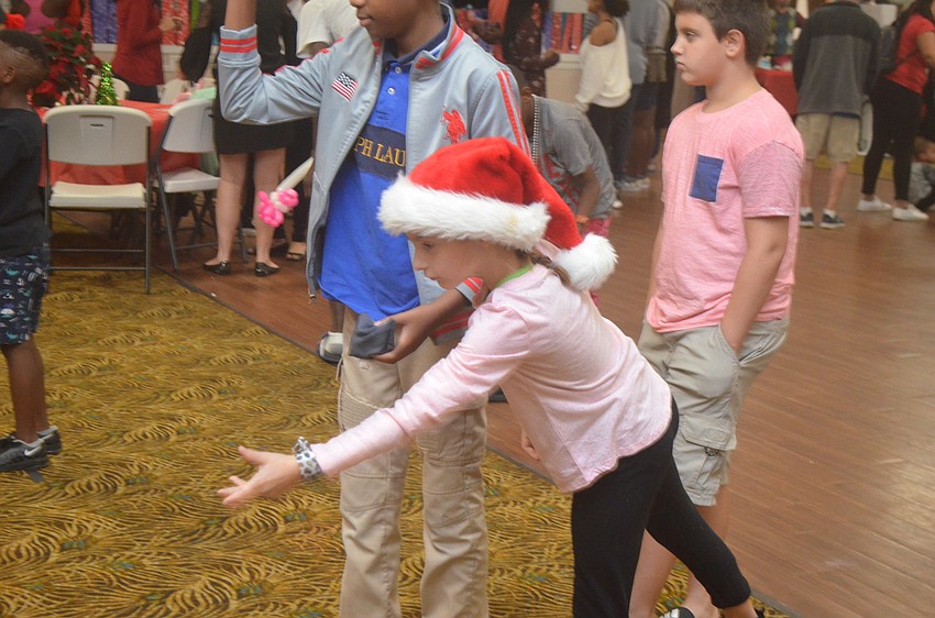 Maggie Blanton plays bean bag toss.