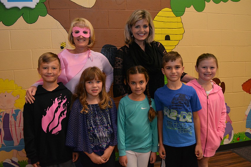 Teacher Tina Peters and Bradenton Kiwanis K-Kids sponsor Laurie Fox pose with K-Kids participants (left to right) Gage Fisher, Bella Goudelock, Natalyn Xynidis, Ethan Schefft and Emilia Kulikowsk.