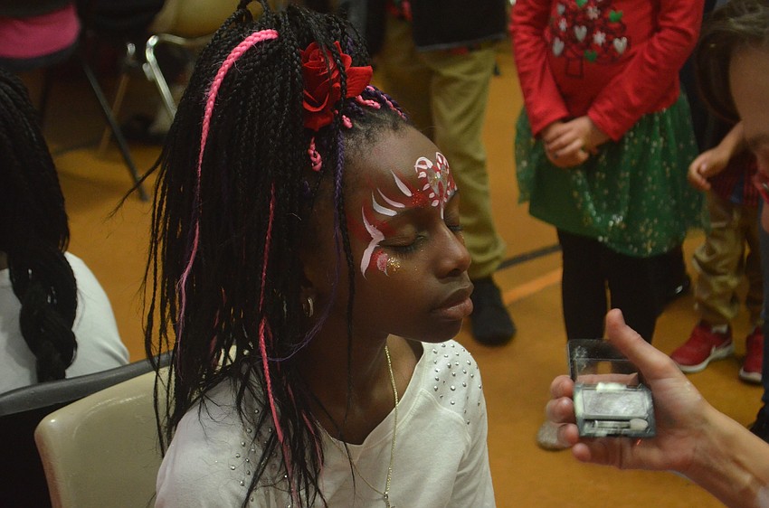 Ebony Phillips gets her face painted.