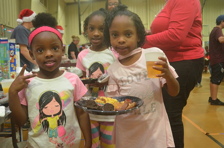 Kylie Hunter, Princess Hunter and Michaela Hunter grab breakfast before meeting Santa.