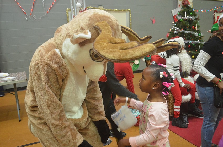 Alanin Storey talks to Rudolph the Red-Nosed Reindeer.