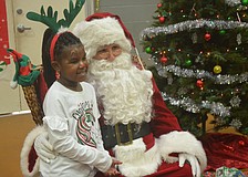 Amani Carter poses for a picture with Santa.