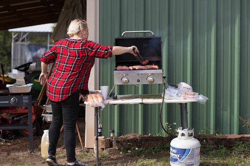 Delilah Donoho grills lunch.