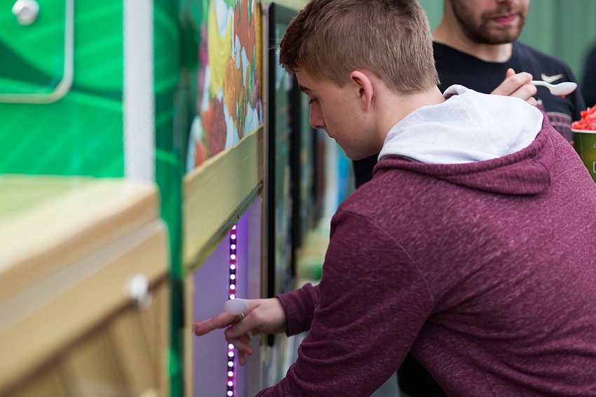 Jay Hudsen refills his snowcone.
