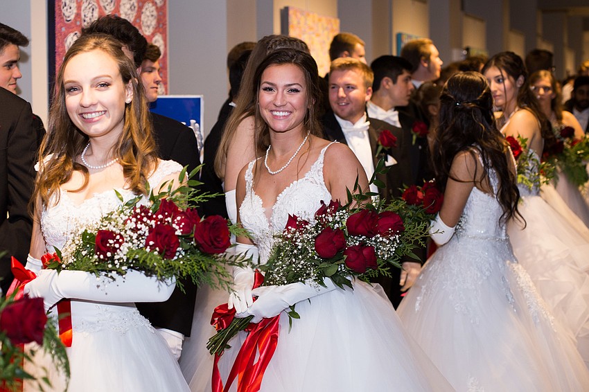 Hannah Cavis and Caroline Diesel smile for the camera as they get in line in Holley Hall.
