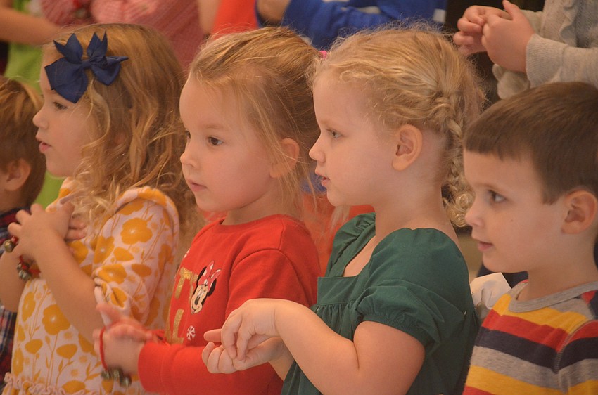 Charlie Weigkamp, Zoey Stine, Olivia Bressan and Graham Morgan were all a part of the Christmas program on Dec. 17.