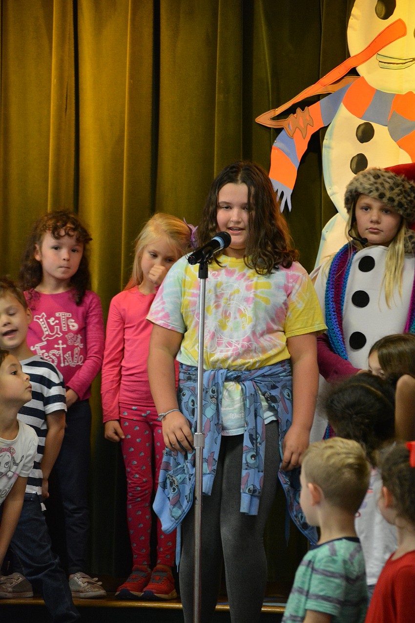 Brooke Dilen, center, narrates part of the 