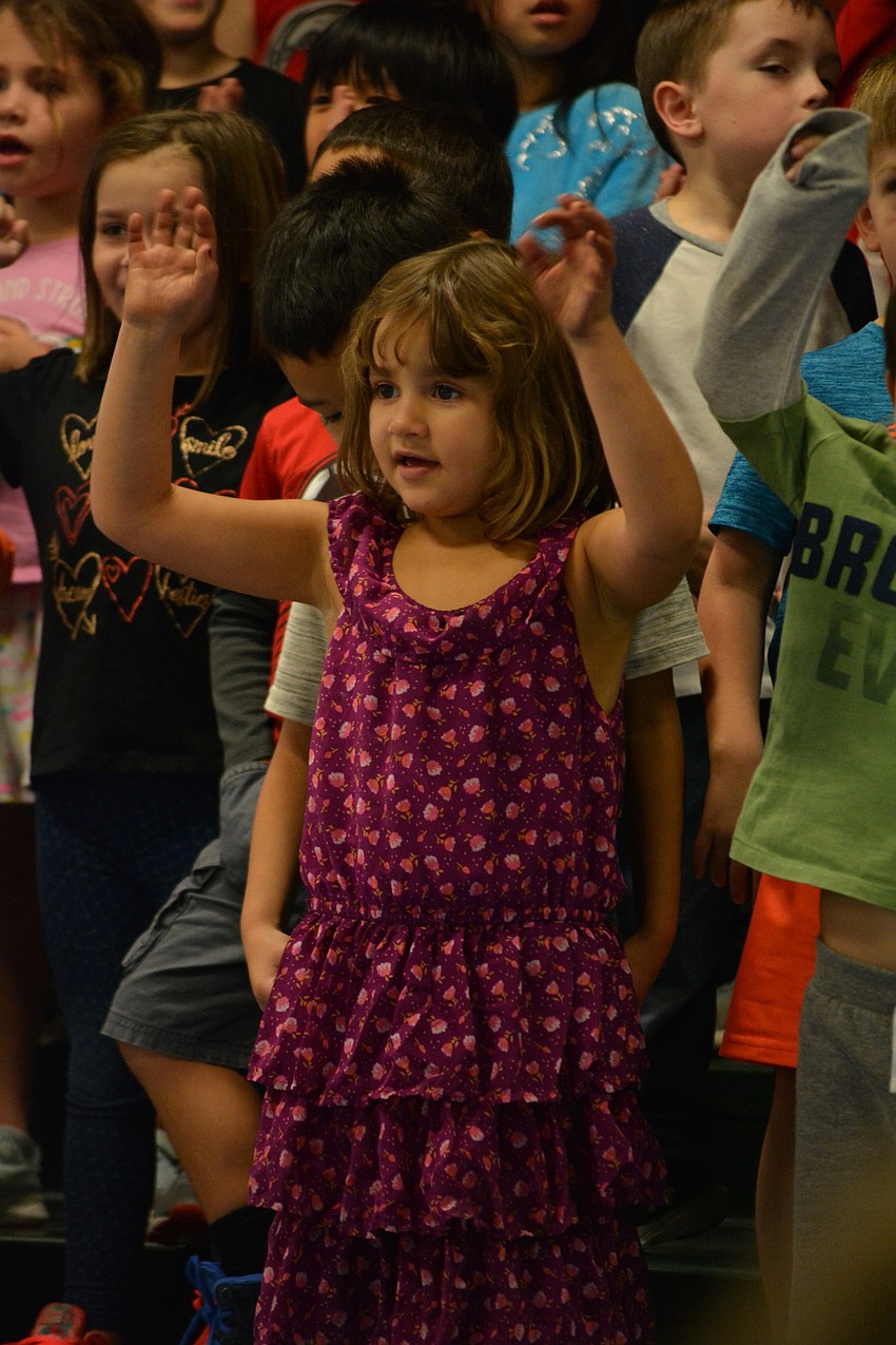 Kindergartener Isabella Madrid sings about how cold Sneezy is.